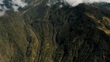 Scenic View Of Tungurahua Volcano Full Of Clouds In The Andes Near Baños de Agua Santa, Ecuador. Aerial Tilt-up