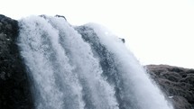 water flowing over a waterfall 