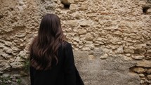 Woman Walks Through The Village Of Gerace