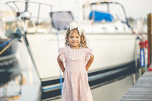 portrait of a little girl on a dock 