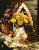 flowers in vases and sheet music 
