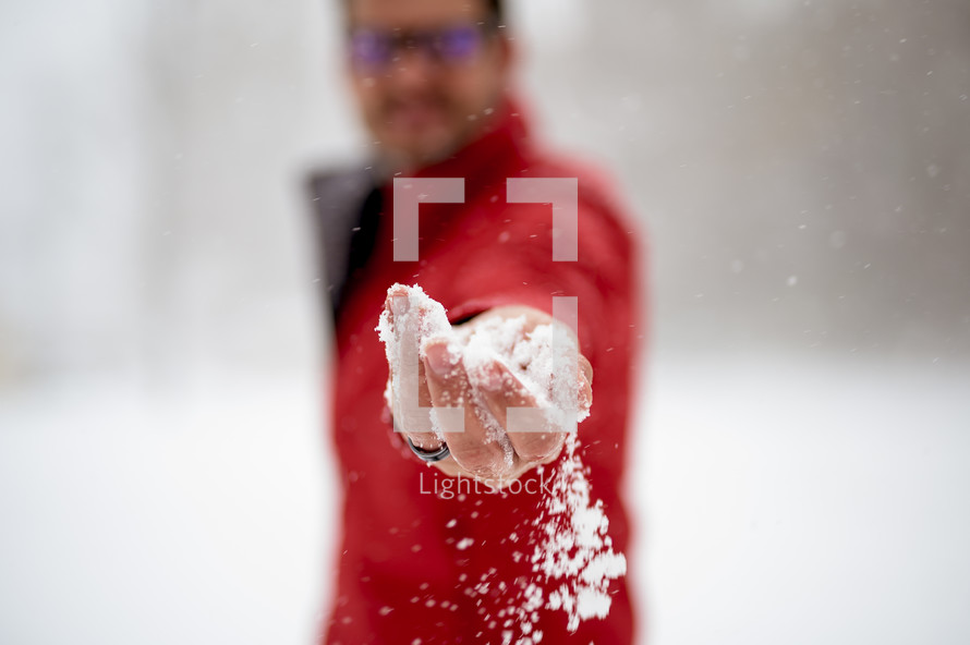 man playing in snow 