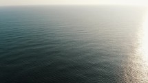 Rippled Ocean Water With Sunlight Reflection at the beach in Guatemala - Aerial drone shot