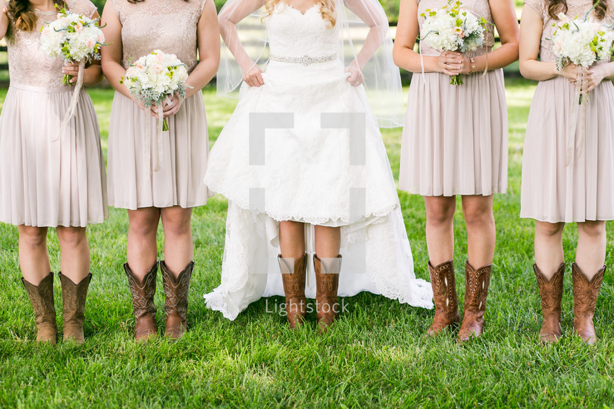 bride and bridesmaids wearing cowboy boots 
