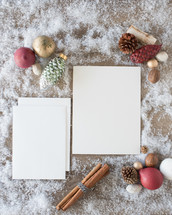 envelopes and white paper on snow with festive holiday border 