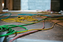 Extension cords on the cement floor.