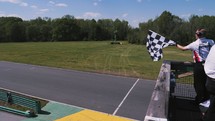 Waving the finish flag at race.
