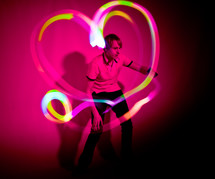 heart shape in lights around a man