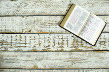 open Bible on ivory wood 