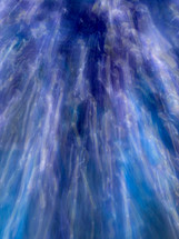 Light trails in blue and purple - rotated to horizontal, it may suggest wind - abstract background