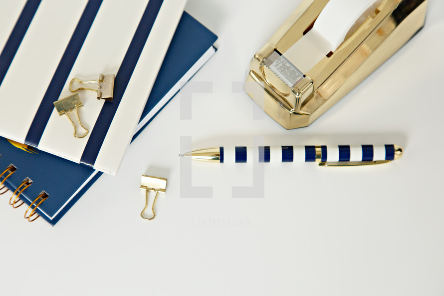navy and gold items on a desk 