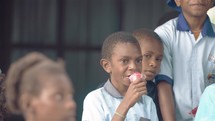 school kids eating  in Papua New Guinea 