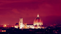 domed cathedral at night under a red sky 