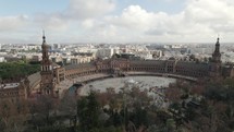 Spain Square and Maria Luisa Park, aerial pan with city view; Seville	