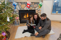 family reading a Bible at Christmas 