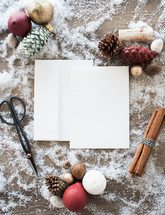 white paper and ornaments in snow 