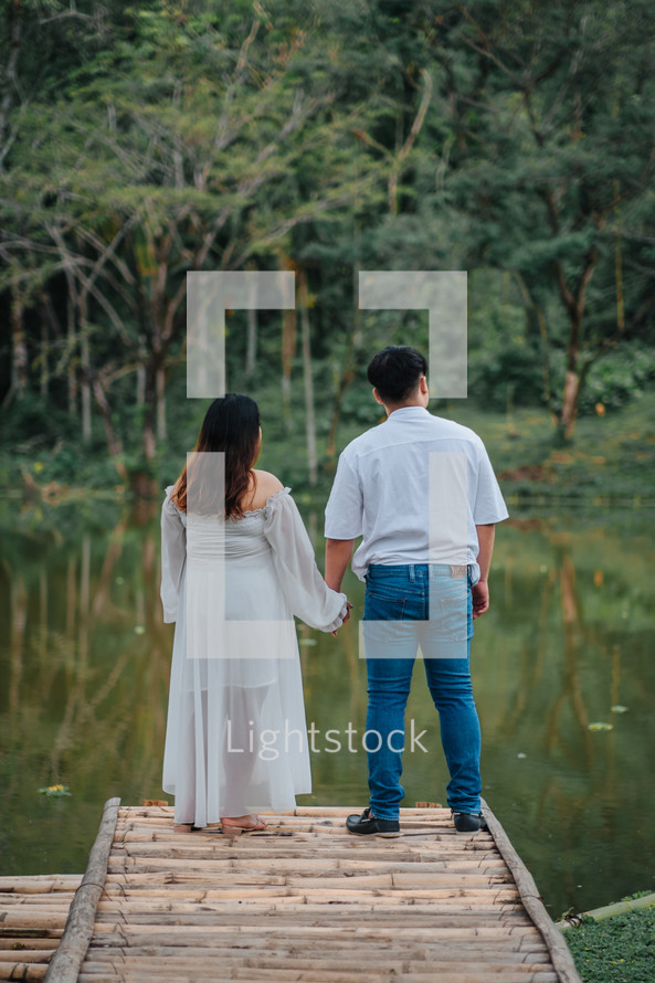 portrait of a couple outdoors holding hands 