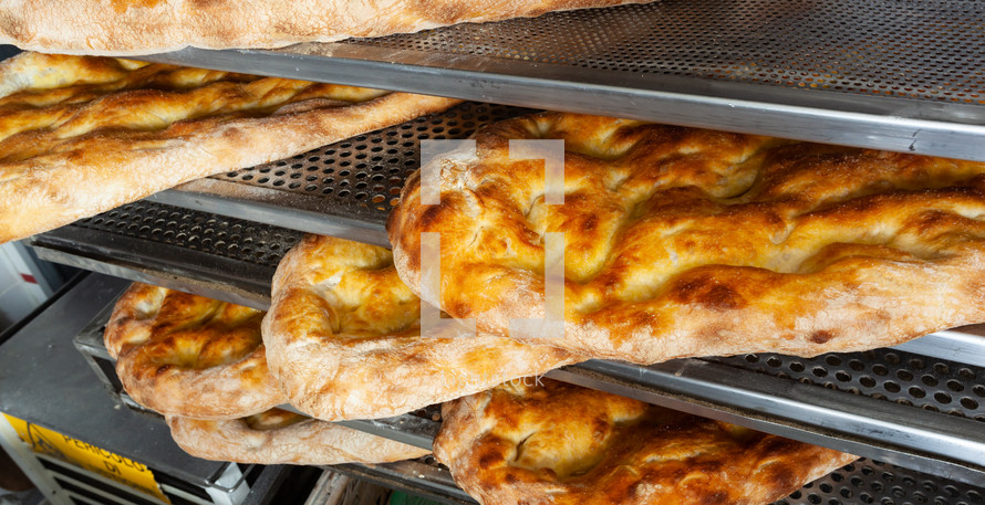 Schiacciata all'olio is one of Tuscany's top bakery treats. It's a type of flat bread made with flour, water, yeast, salt and olive oil.