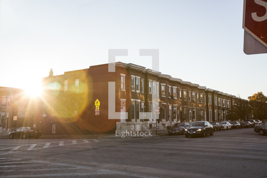 sunburst in front of townhouses 
