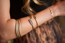 Woman's arm with bracelets.