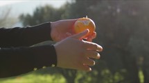 Hand Of Farmer Girl Peeling Sicily Orange Food