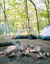 tents by a camp fire 