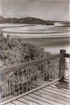 view of a beach from a deck 