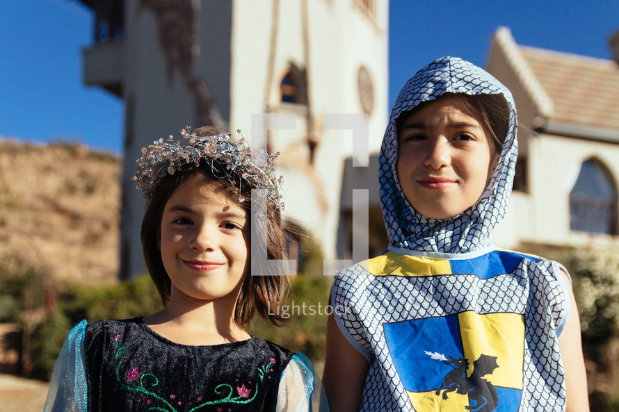 children dressed up as a knight and princess 