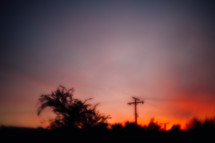 blurry image of power lines at sunset 