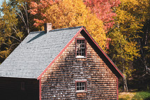 house with wooden shingles in fall 