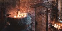wooden cellar door and candles 