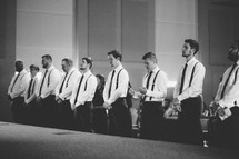groomsmen praying 