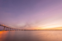 a coastal bridge at sunset 