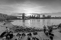 bridge over water in NYC and sunbathers 