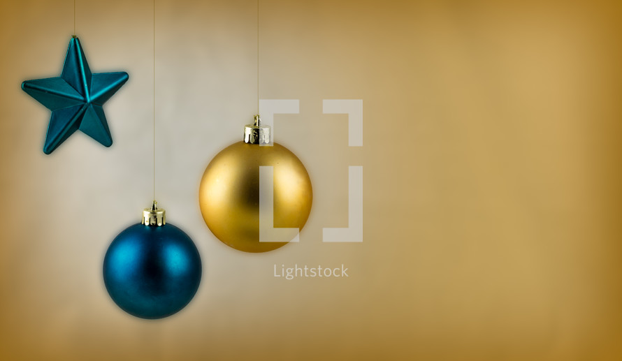 Blue and gold hanging Christmas ornaments.