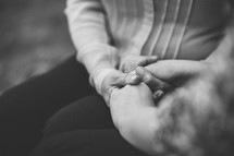 holding hands in prayer