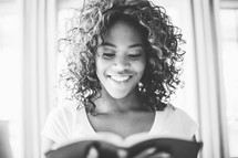 teen girl reading a Bible