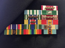 closeup of veteran's military ribbons pinned on uniform