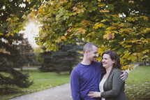 husband and wife outdoors in fall 