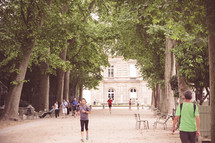 people walking on a path in Paris Luxembourg Gardens