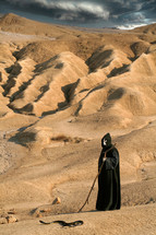 Devil - Death looking away in the desert. Religious concept of Death or the Evil Spirit.
