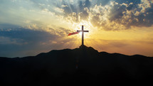 Holy Cross silhouette with red scarf
