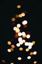 white bokeh lights on a Christmas tree 