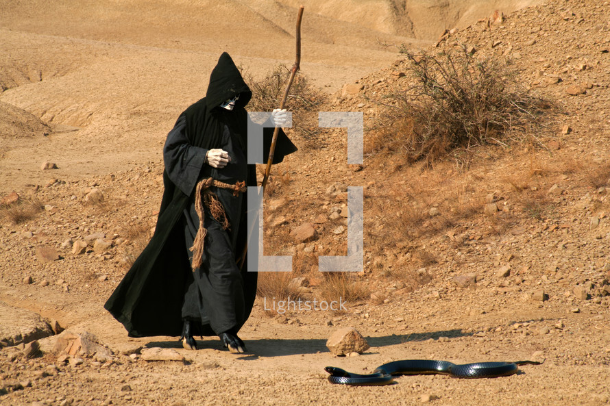 Devil - Death walking through the desert. Religious concept of Death or the Evil Spirit.
