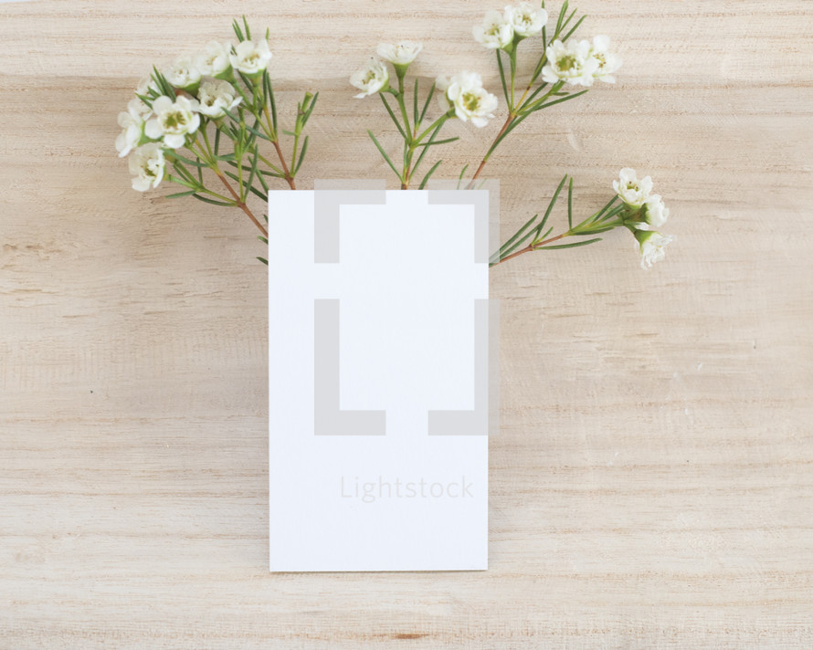 flowers and blank white notecard 