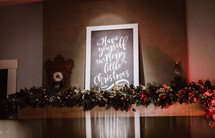 Have Yourself a Merry Little Christmas sign over a mantle 
