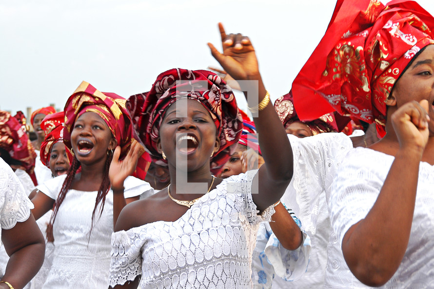 African women clapping and dancing in praise and worship to God
