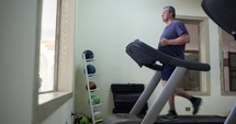 Timelapse of a senior man exercising on treadmill