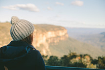 Woman looking out over a canyon.