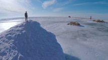a man standing on an iceberg 
